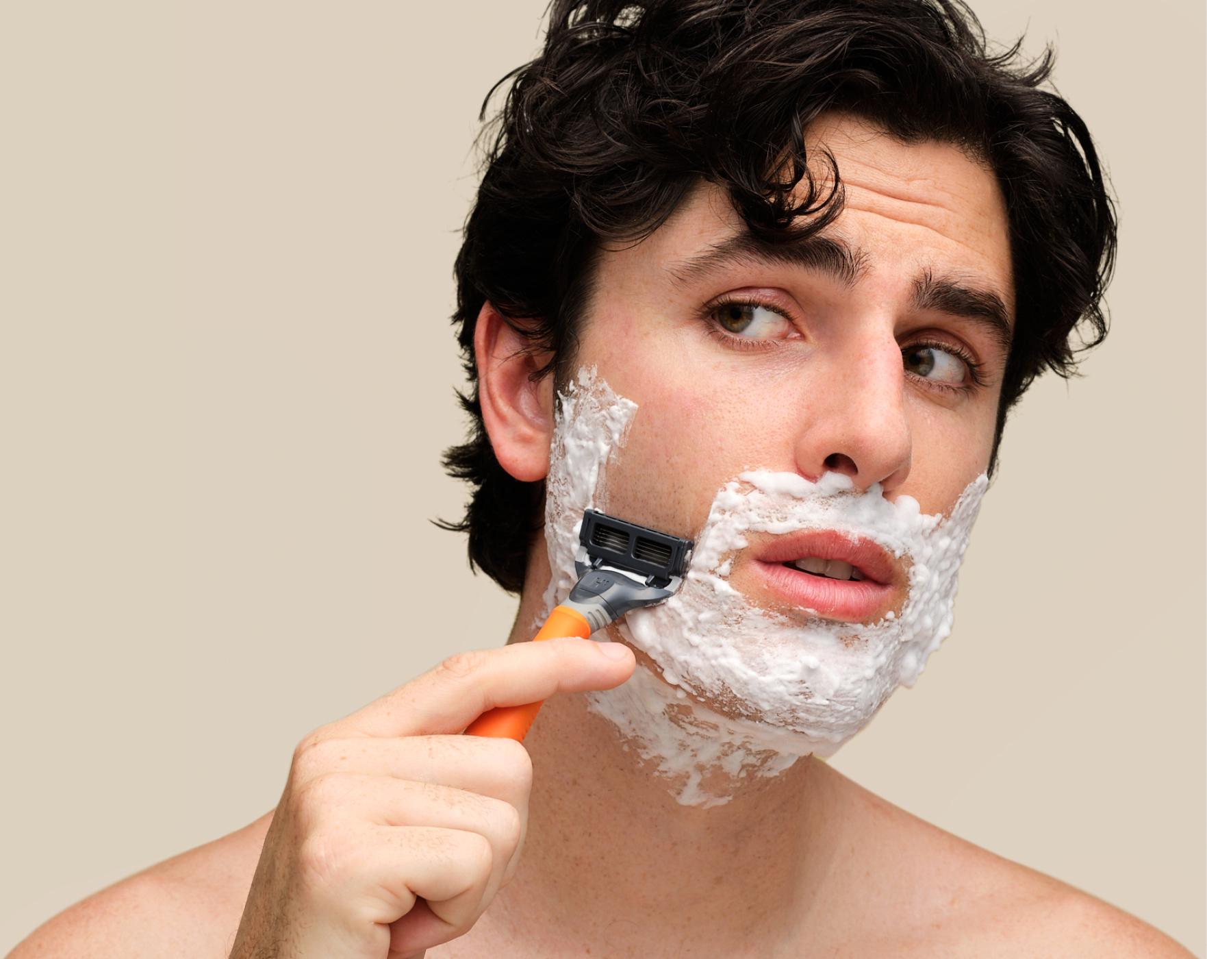 An image of a man shaving with precision using Harry's blades, achieving a clean and smooth shave.