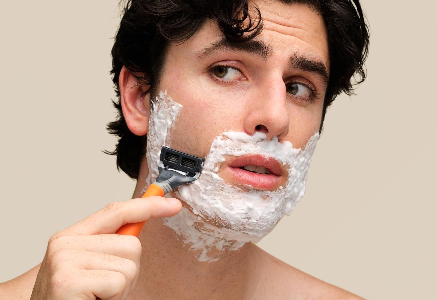 An image of a man shaving with precision using Harry's blades, achieving a clean and smooth shave.